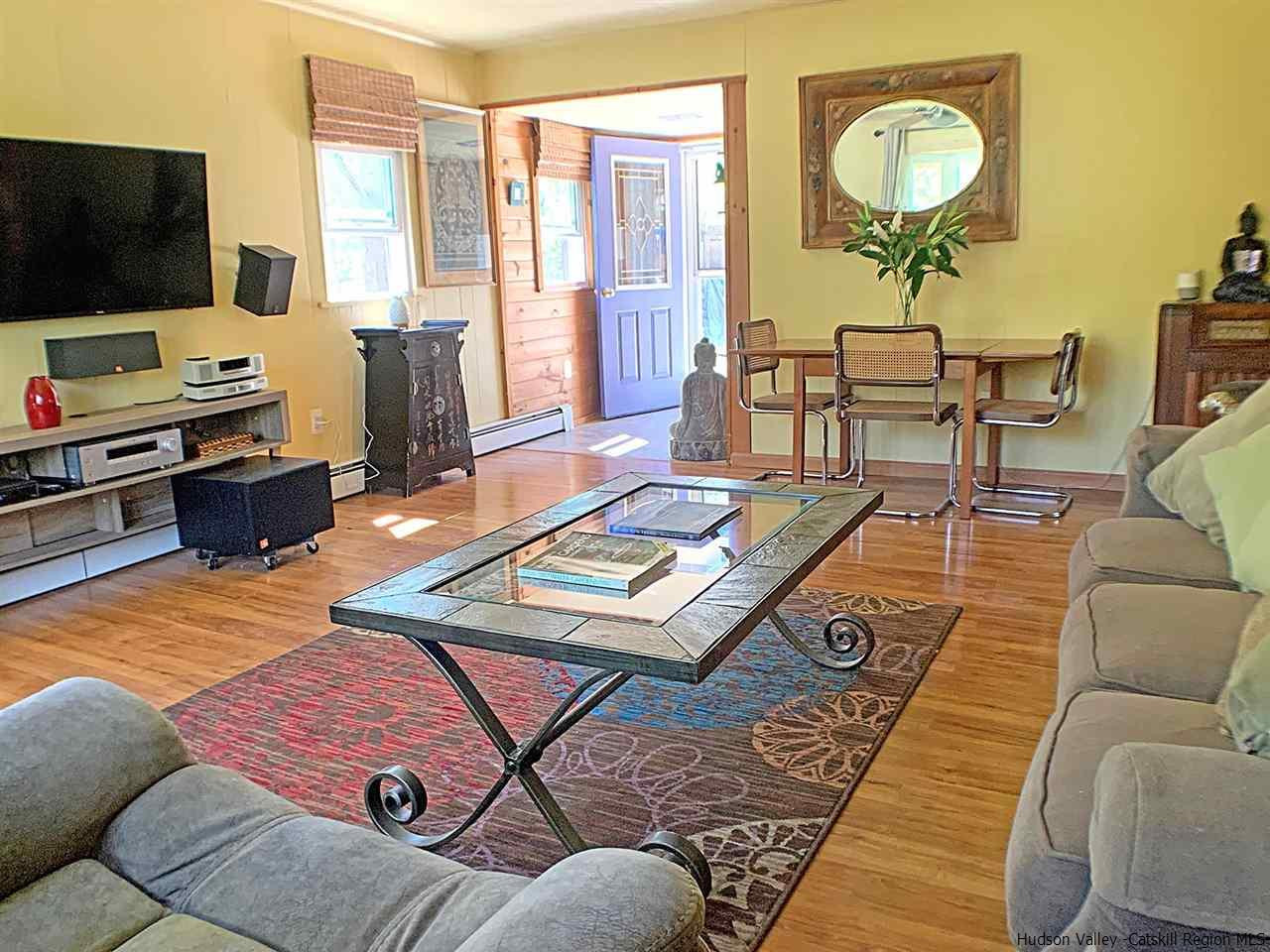56 Bellwood Road Saugerties, NY 12477 - Photo 5 of 35 a living room with furniture and a flat screen tv