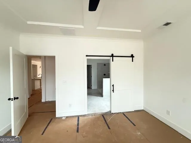 a view of room with window and front door