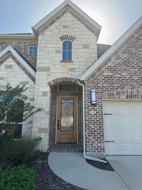 1917 Halkin Road Celina, TX 75009 - Photo 2 of 24 a front view of a house with garden