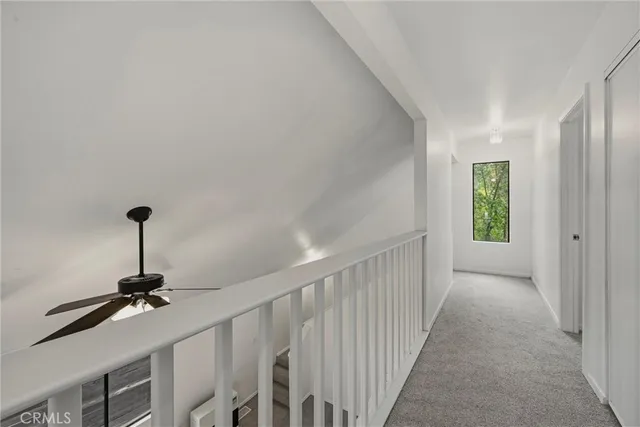 a view of a hallway with windows