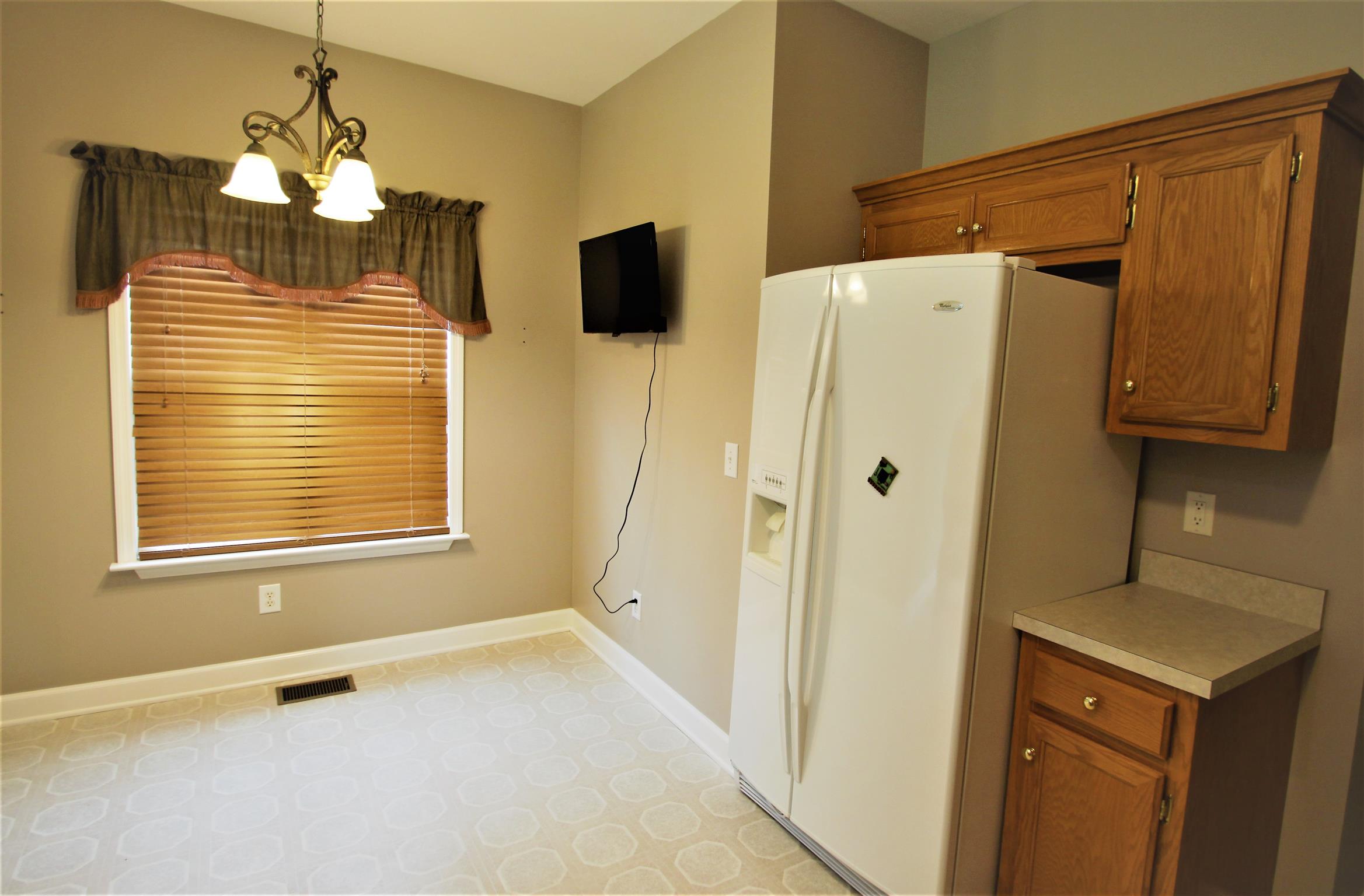 1013 Woods Ferry Road Lebanon, TN 37087 - Photo 12 of 20 a bathroom with a sink a mirror and a shower