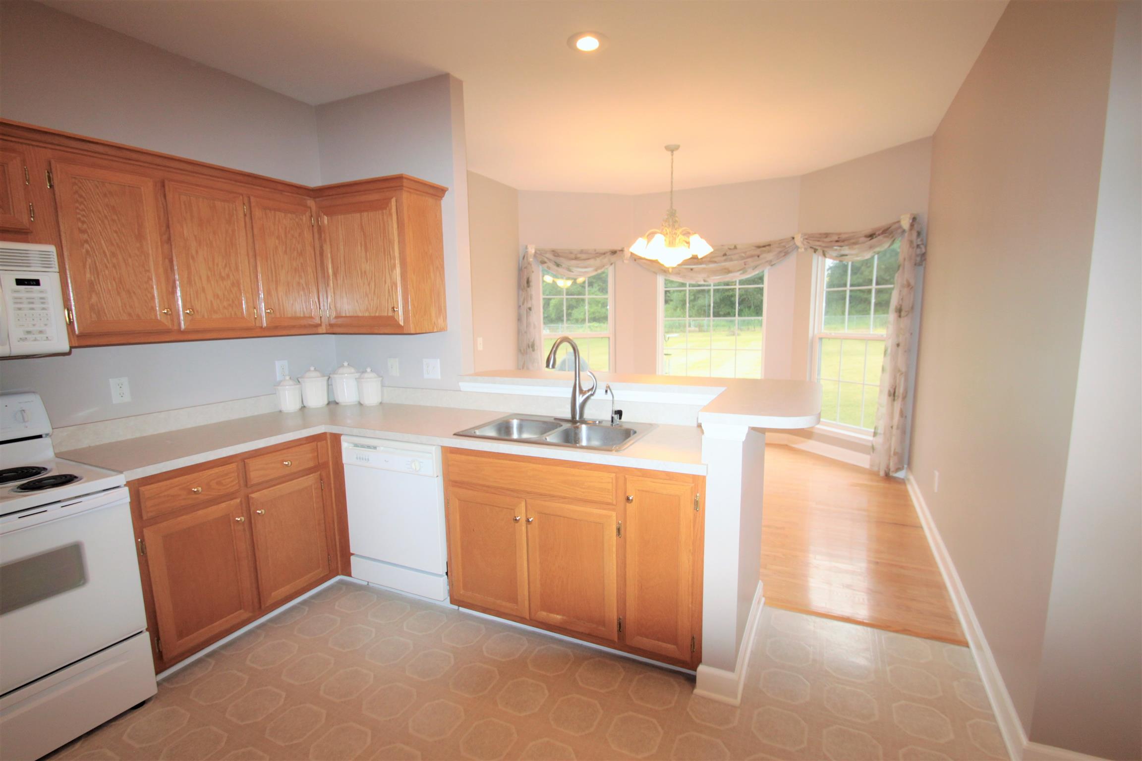 1013 Woods Ferry Road Lebanon, TN 37087 - Photo 8 of 20 a kitchen that has a sink and a stove in it