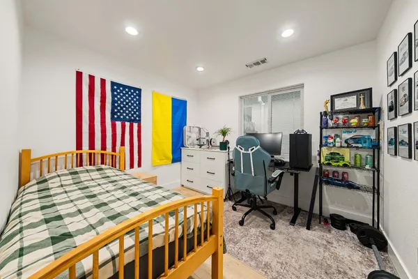 a bedroom with a bed and a table in it