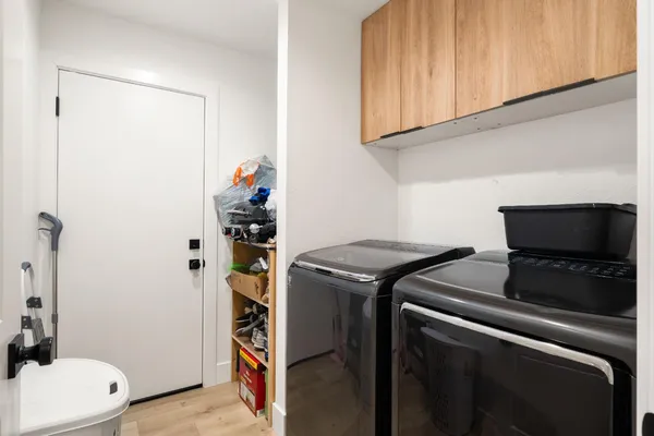 a utility room with dryer and washer