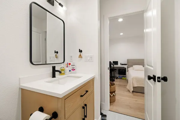 a bathroom with a sink and a mirror