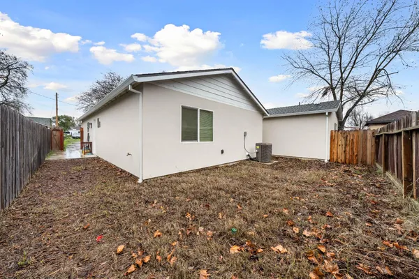 a house view with a backyard space