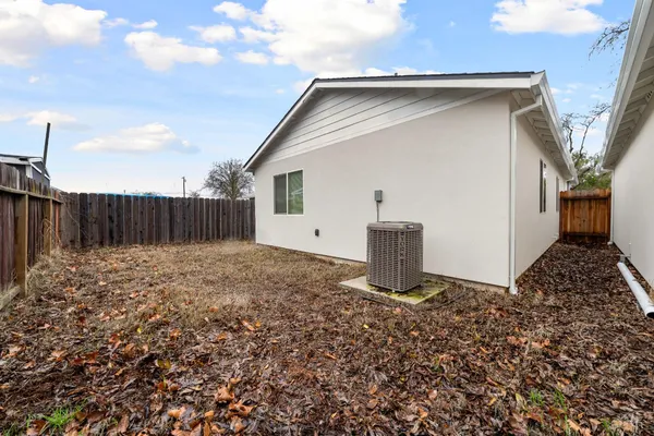 a house view with a backyard space