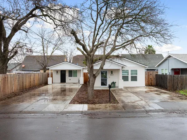 a front view of a house with a yard