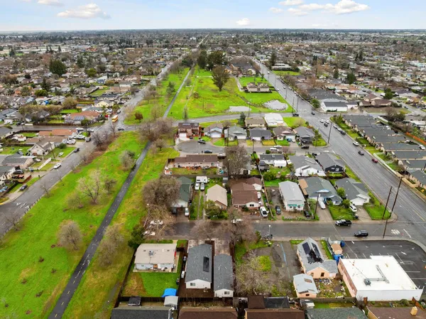 an aerial view of residential houses with outdoor space