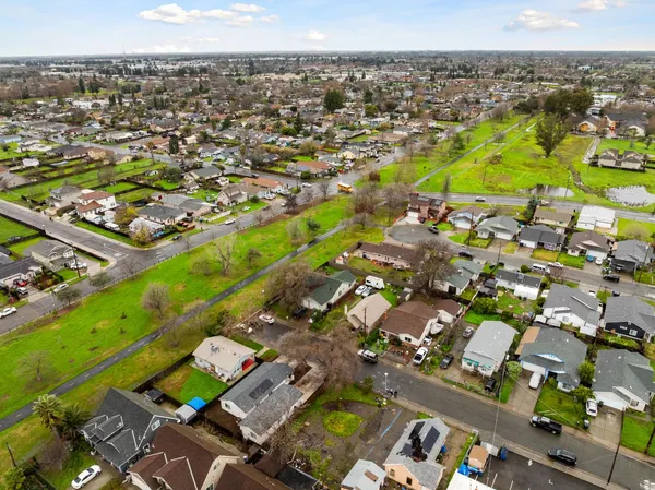 an aerial view of residential houses with outdoor space