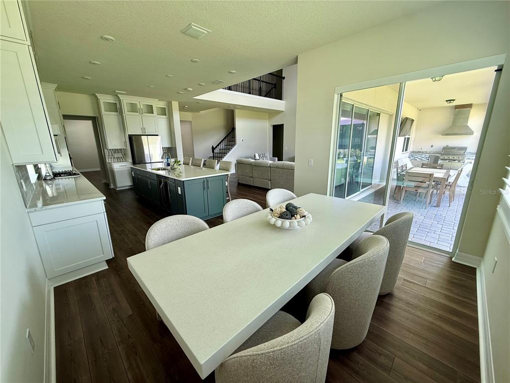 8441 Pk Clf Way Orlando, FL 32836 - Photo 16 of 59 a dining room with furniture and wooden floor