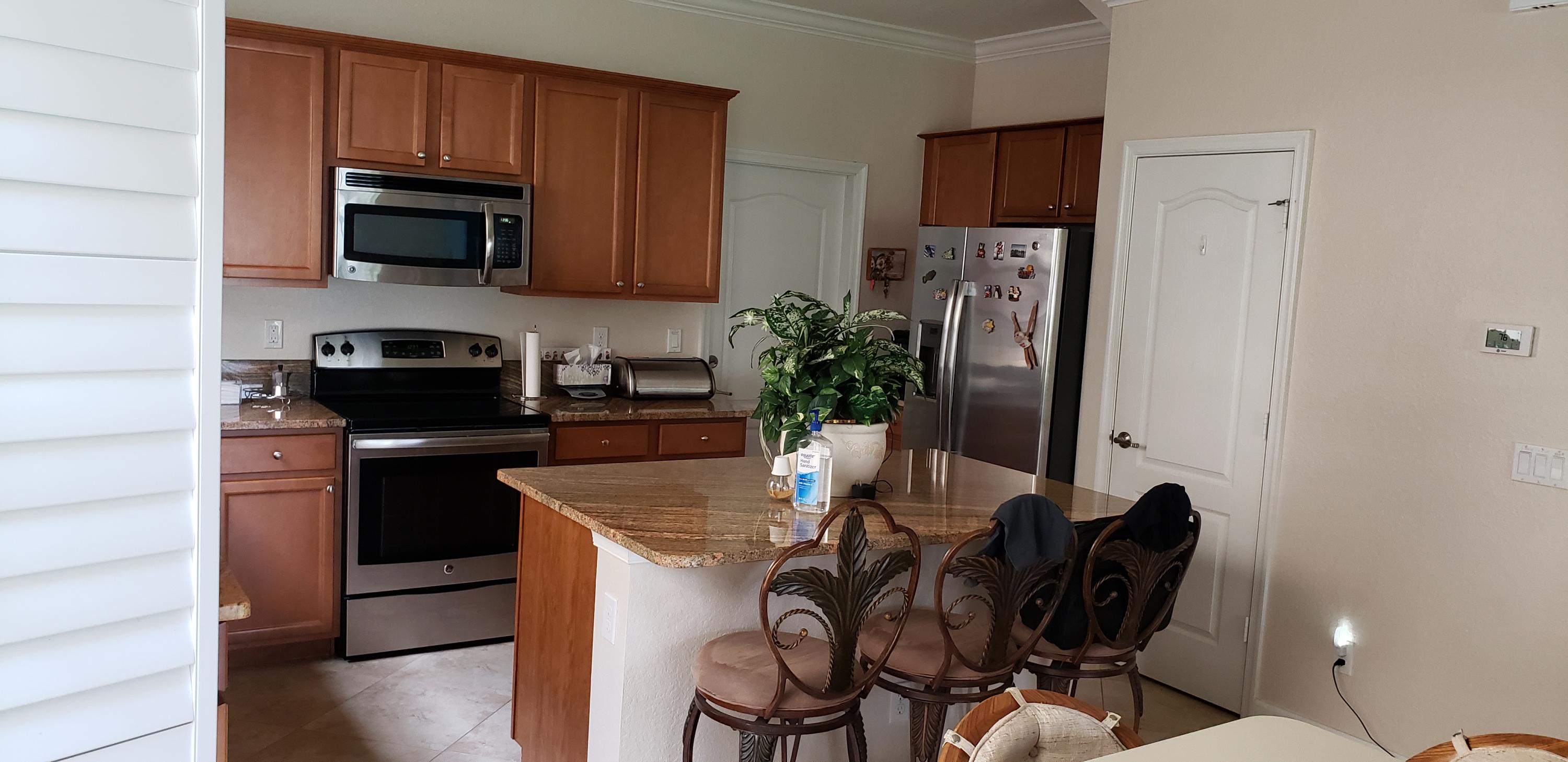9475 Southwest Merlin Court Stuart, FL 34997 - Photo 3 of 10 20210513_123631