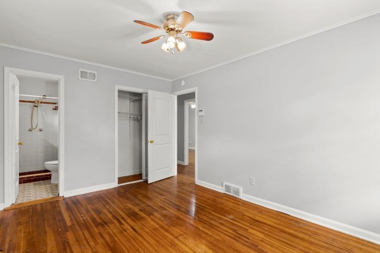 1042 Ivy Road Memphis, TN 38117 - Photo 11 of 27 a view of an empty room with wooden floor