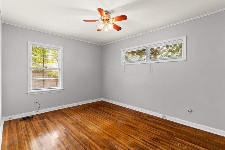 1042 Ivy Road Memphis, TN 38117 - Photo 15 of 27 wooden floor in an empty room with a window