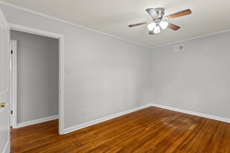 1042 Ivy Road Memphis, TN 38117 - Photo 16 of 27 a view of empty room with wooden floor
