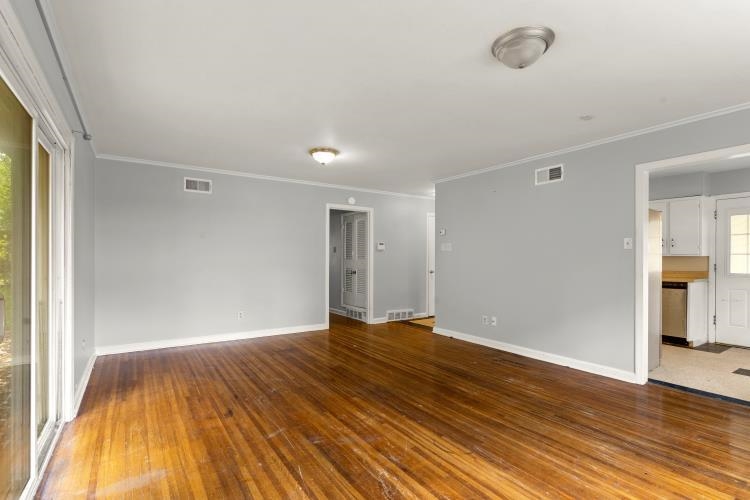 1042 Ivy Road Memphis, TN 38117 - Photo 20 of 27 a view of an empty room with wooden floor
