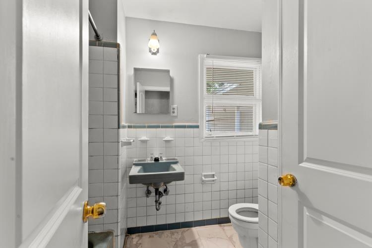 1042 Ivy Road Memphis, TN 38117 - Photo 23 of 27 a bathroom with a sink toilet and shower