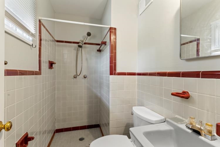 1042 Ivy Road Memphis, TN 38117 - Photo 24 of 27 a bathroom with a sink toilet and shower