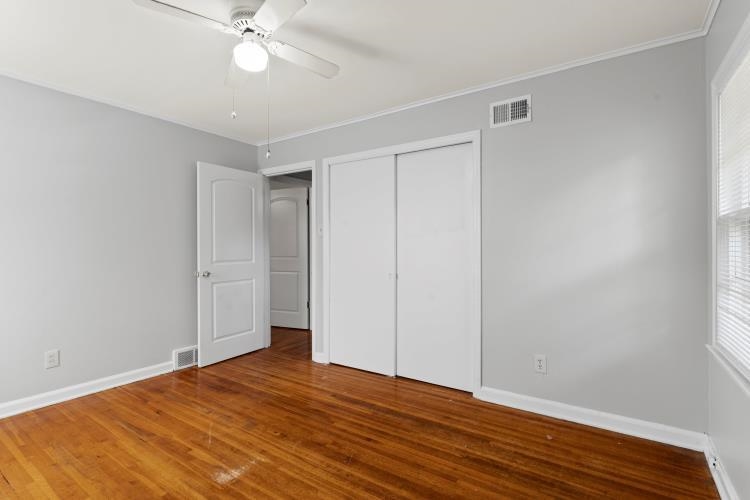 1042 Ivy Road Memphis, TN 38117 - Photo 10 of 27 a view of an empty room with wooden floor