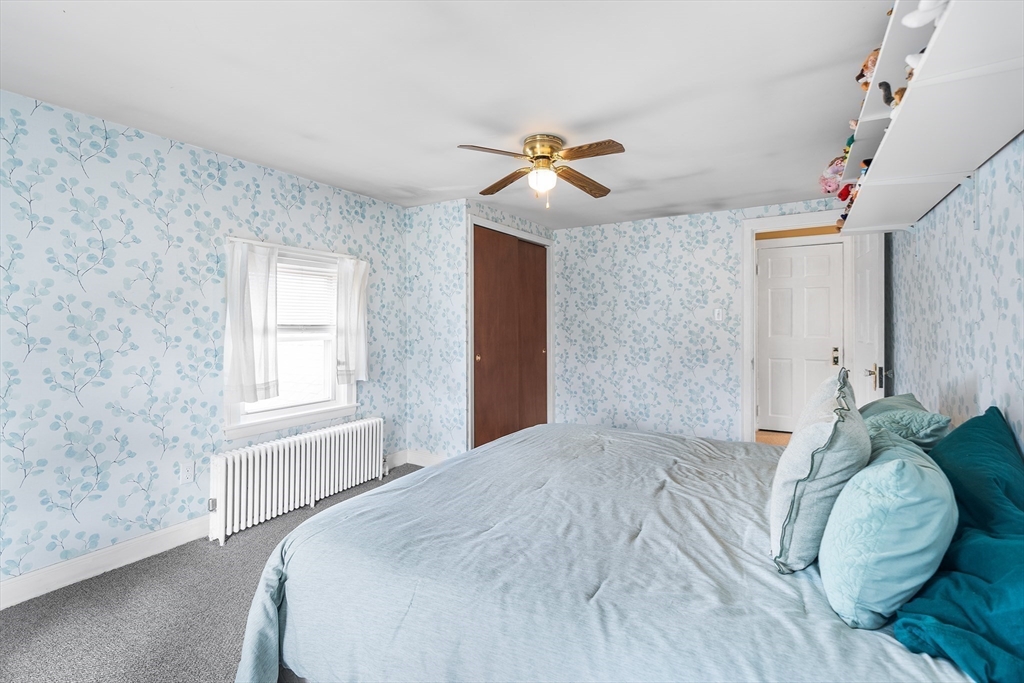 41 Pilgrim Road Weymouth, MA 02191 - Photo 16 of 27 a bedroom with a bed and a window