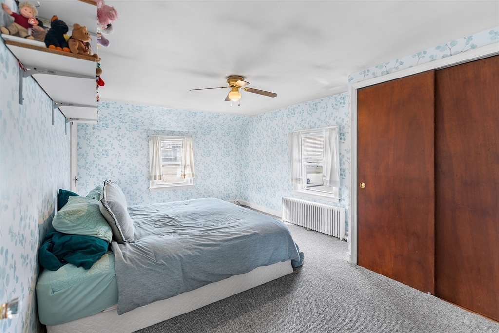 41 Pilgrim Road Weymouth, MA 02191 - Photo 17 of 27 a bedroom with a bed and a window