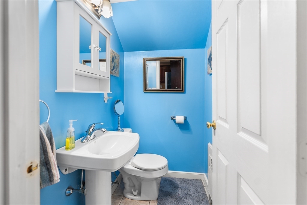 41 Pilgrim Road Weymouth, MA 02191 - Photo 7 of 27 a bathroom with a sink a toilet and mirror
