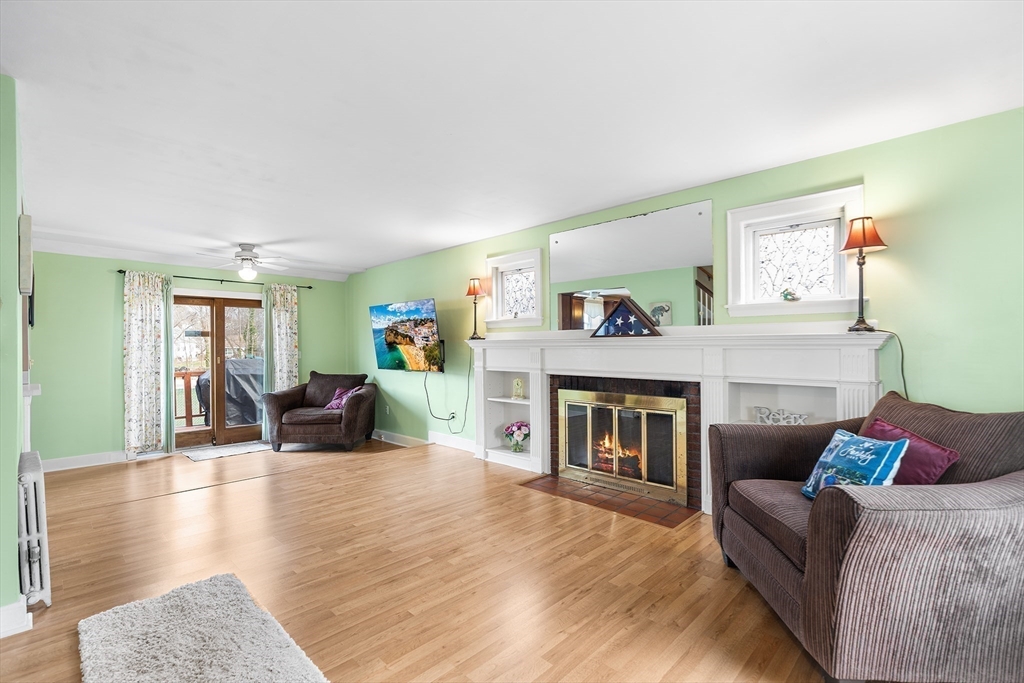 41 Pilgrim Road Weymouth, MA 02191 - Photo 9 of 27 a living room with furniture and a fireplace