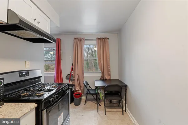 a kitchen with a stove and a microwave