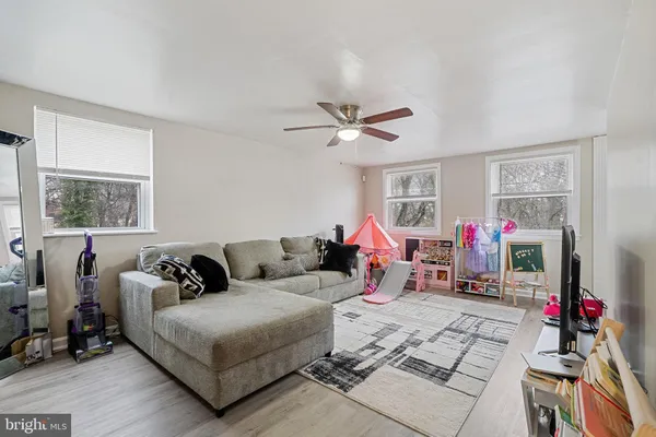 a living room with furniture and a window