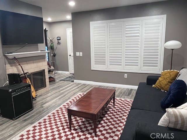 7300 Quill Drive, Unit 210 Downey, CA 90242 - Photo 3 of 12 a bedroom with a bed and a television