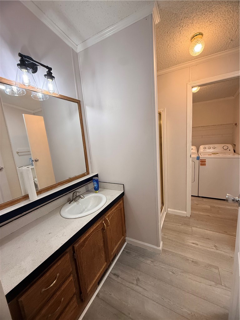 307 West 7th Street St. Elmo, IL 62458 - Photo 13 of 17 a bathroom with a sink a mirror and a shower
