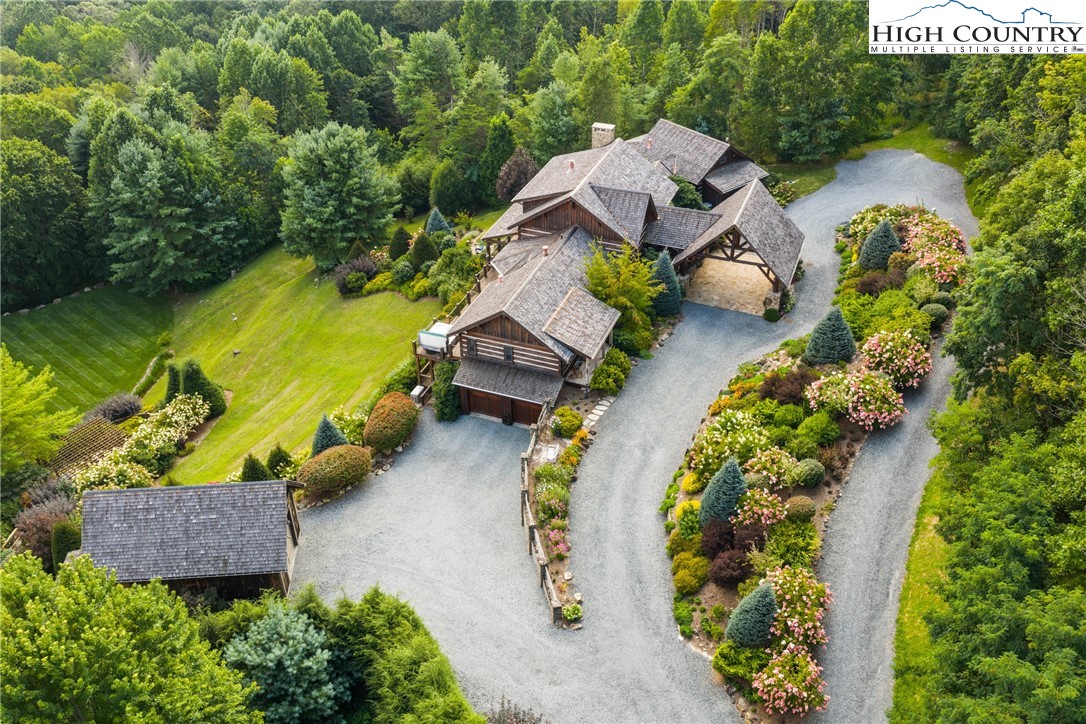 333 Windy Ridge Road Vilas, NC 28692 - Photo 8 of 46 an aerial view of a house with outdoor space