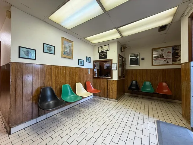 a living room with furniture and flat screen tv