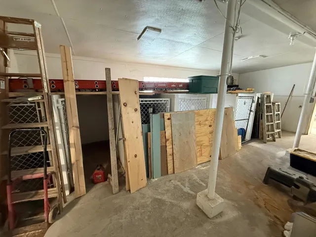 a view of a gallery with wooden floor