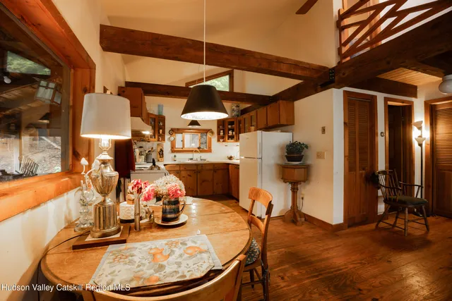 a kitchen with stainless steel appliances a sink and a refrigerator