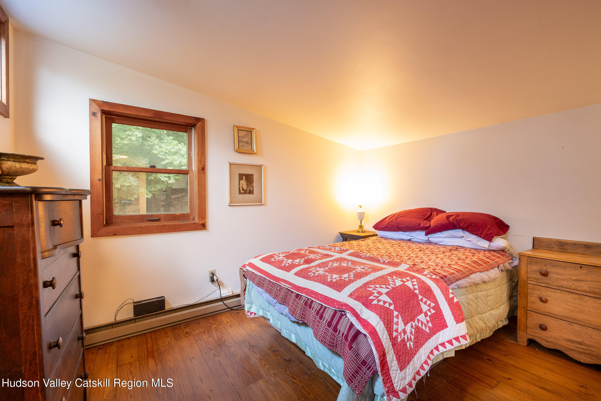 1635 High Falls Road Catskill, NY 12414 - Photo 20 of 43 a bedroom with a bed and a window