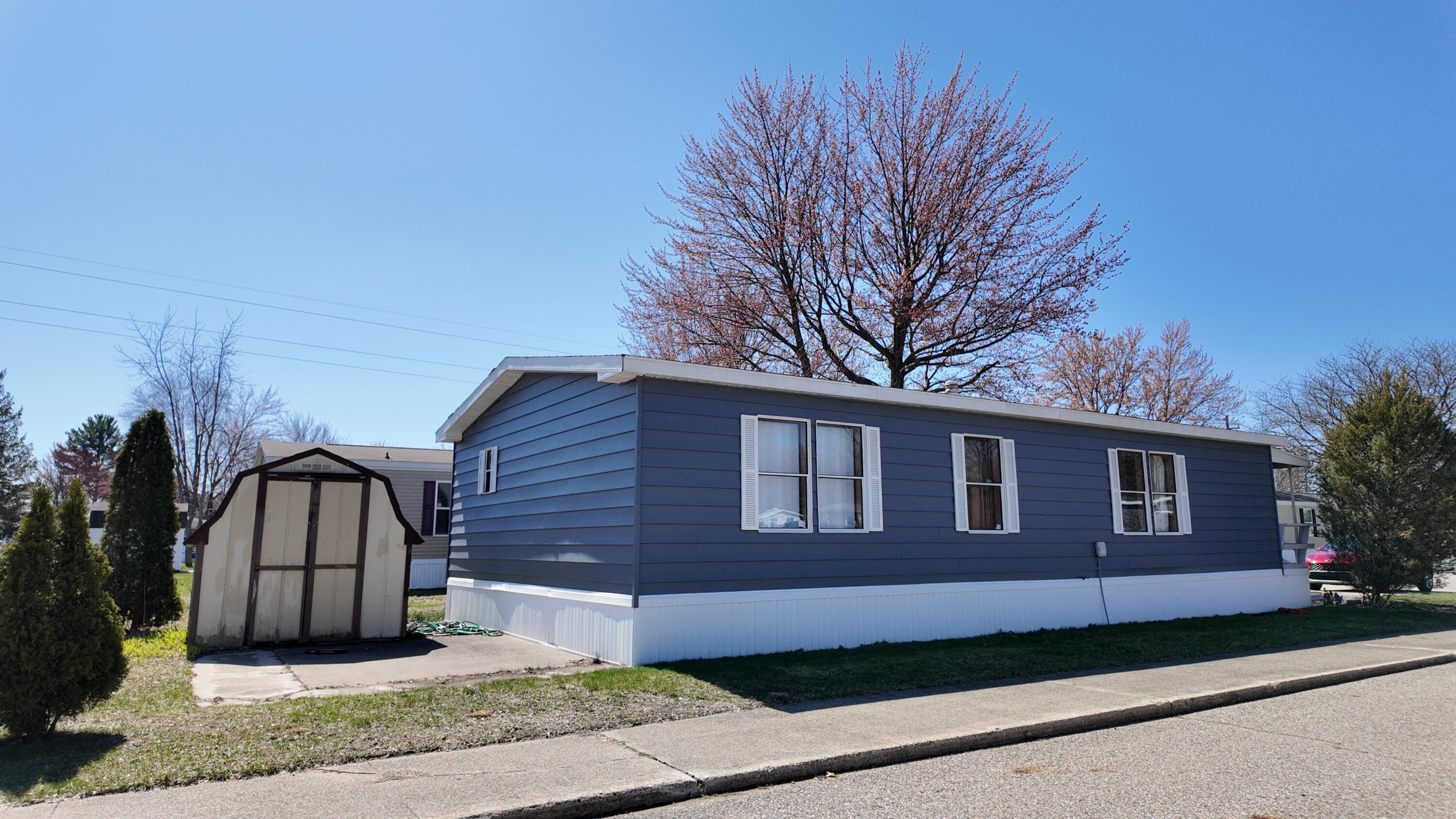 1700 Robbins Road, Unit 163 Grand Haven, MI 49417 - Photo 19 of 21 DJI_20260406135340_0971_D