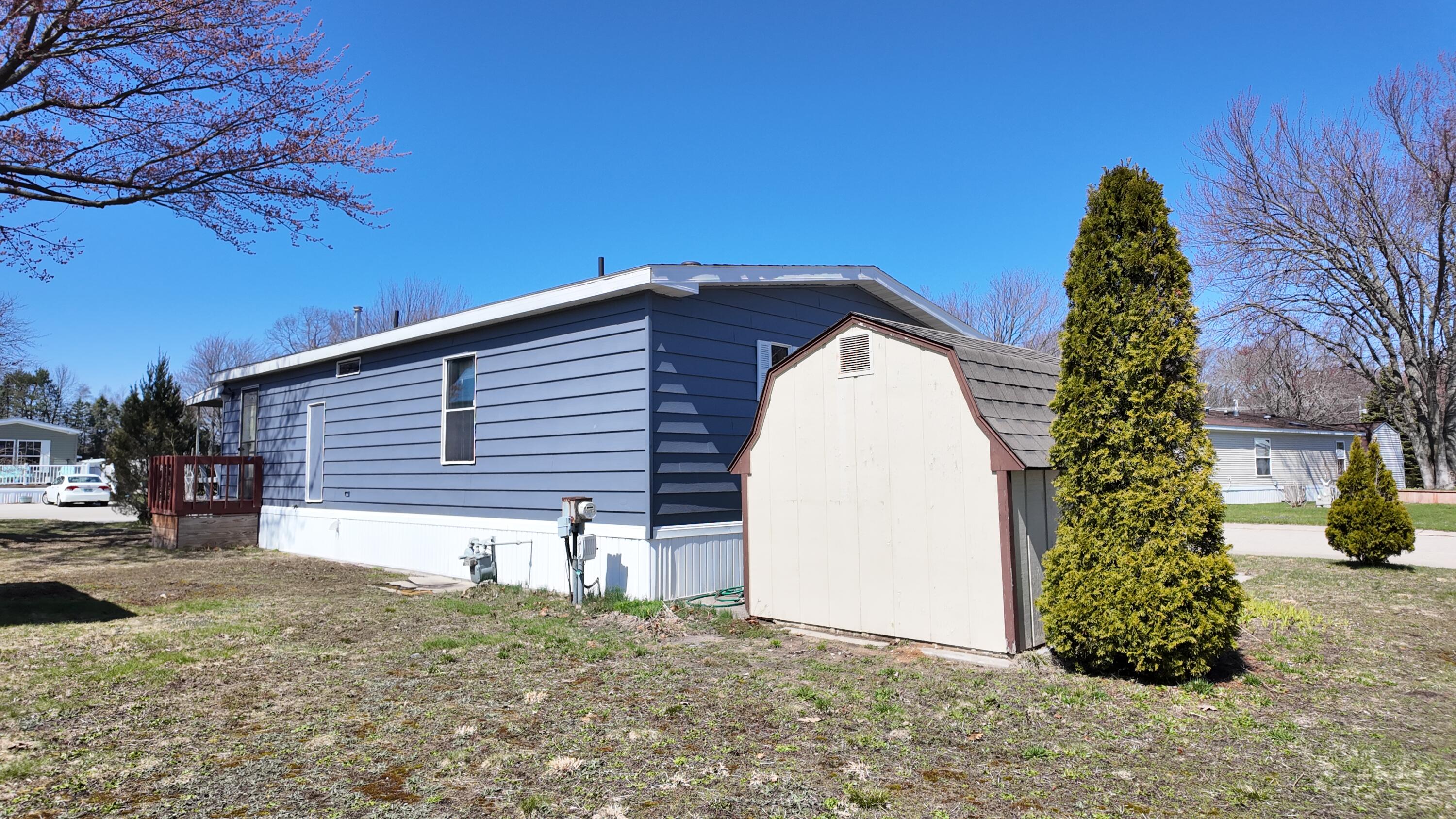 1700 Robbins Road, Unit 163 Grand Haven, MI 49417 - Photo 20 of 21 DJI_20260406135404_0972_D
