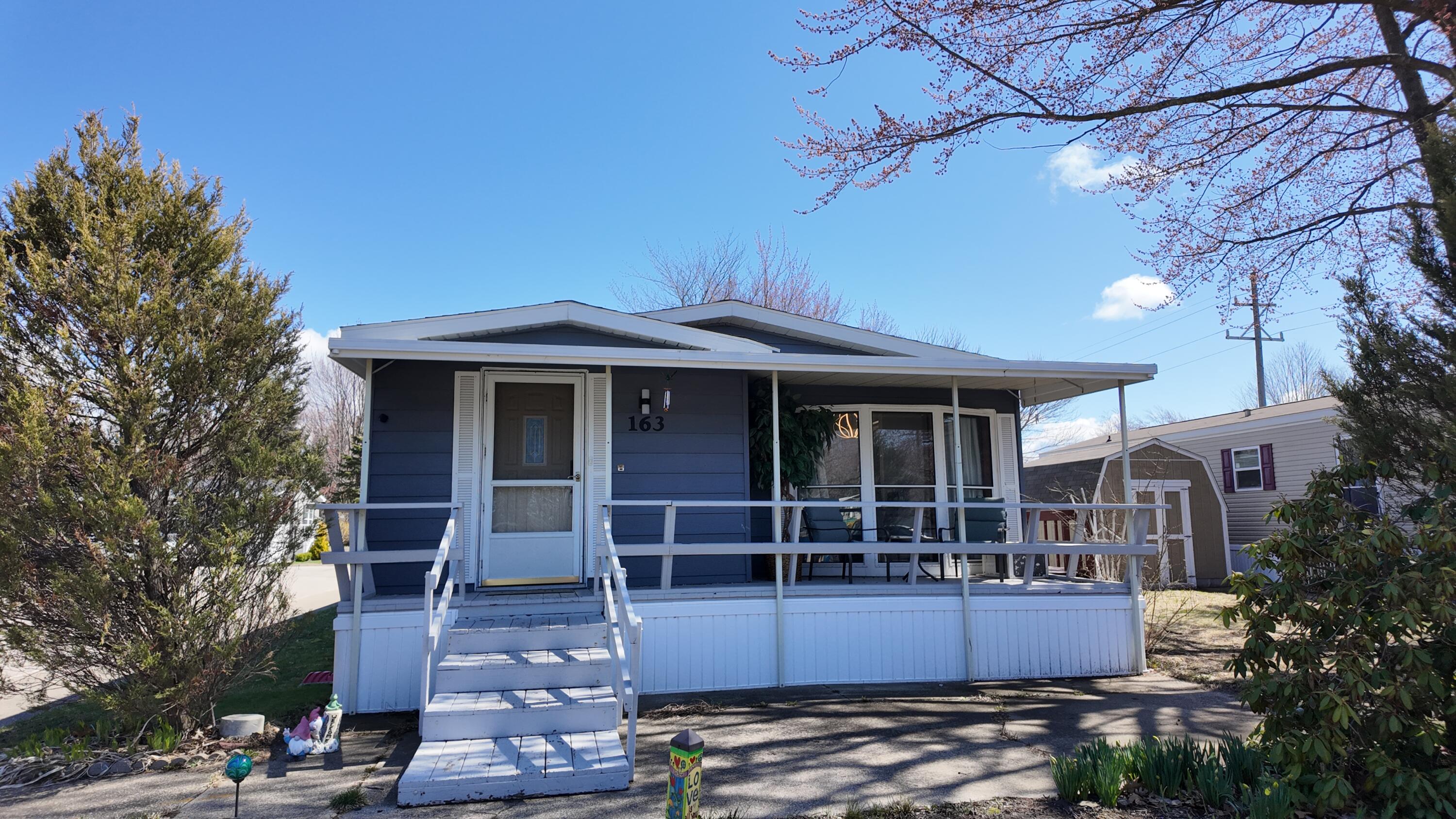 1700 Robbins Road, Unit 163 Grand Haven, MI 49417 - Photo 2 of 21 DJI_20260406135257_0968_D