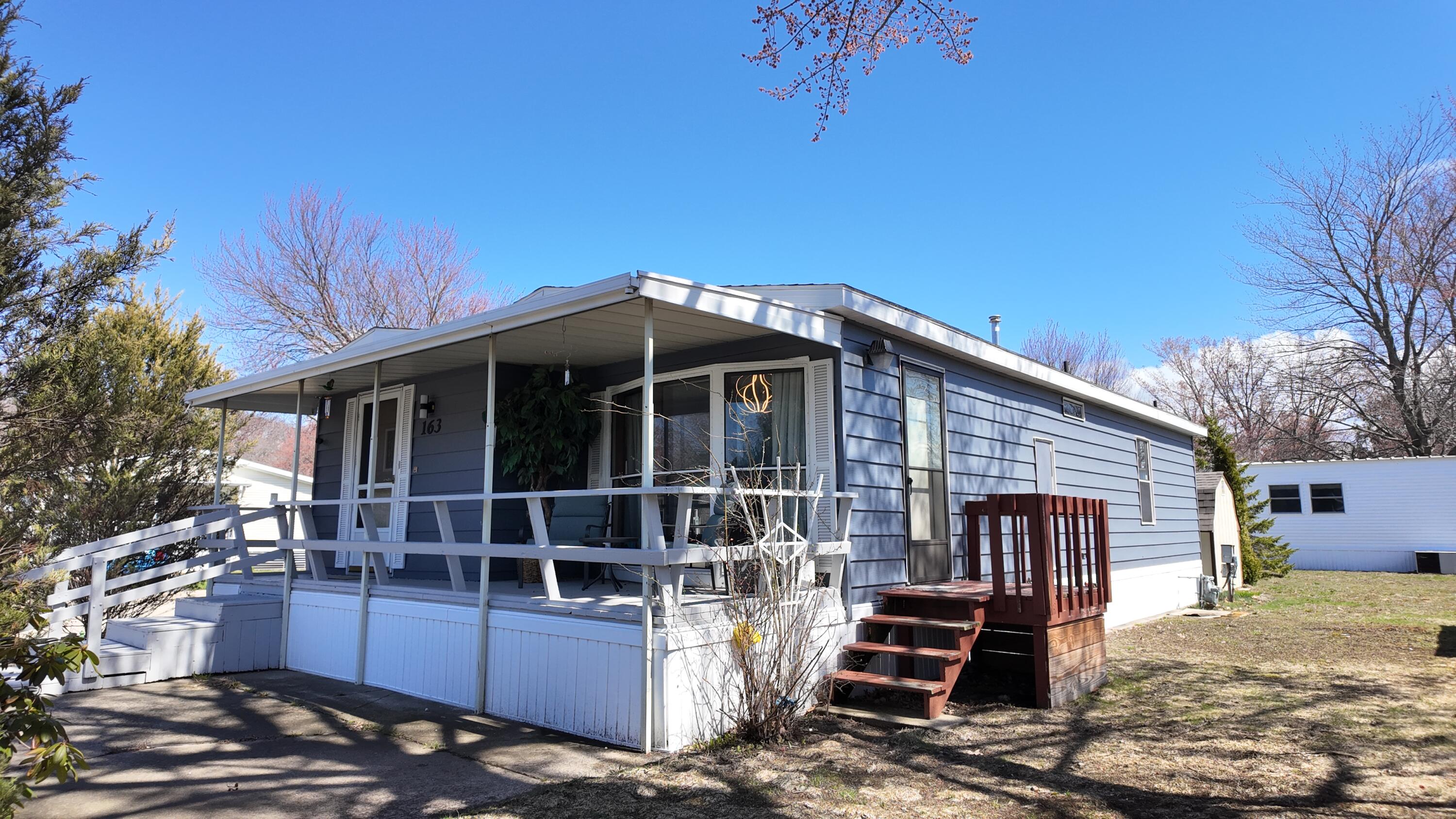 1700 Robbins Road, Unit 163 Grand Haven, MI 49417 - Photo 3 of 21 DJI_20260406135427_0973_D