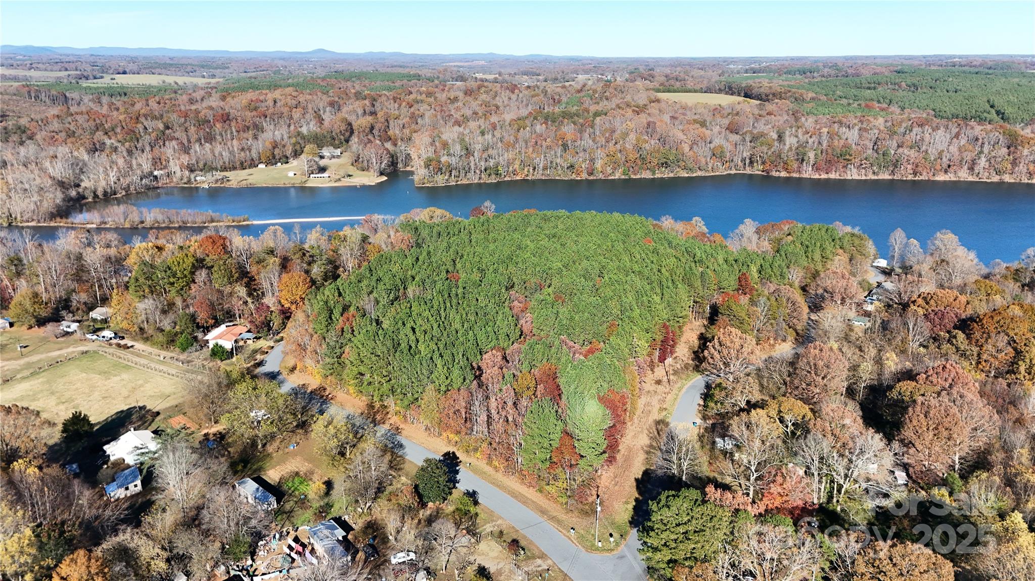 4270 Laurel Hill Road Claremont, NC 28610 - Photo 3 of 6 a view of a lake with a mountain