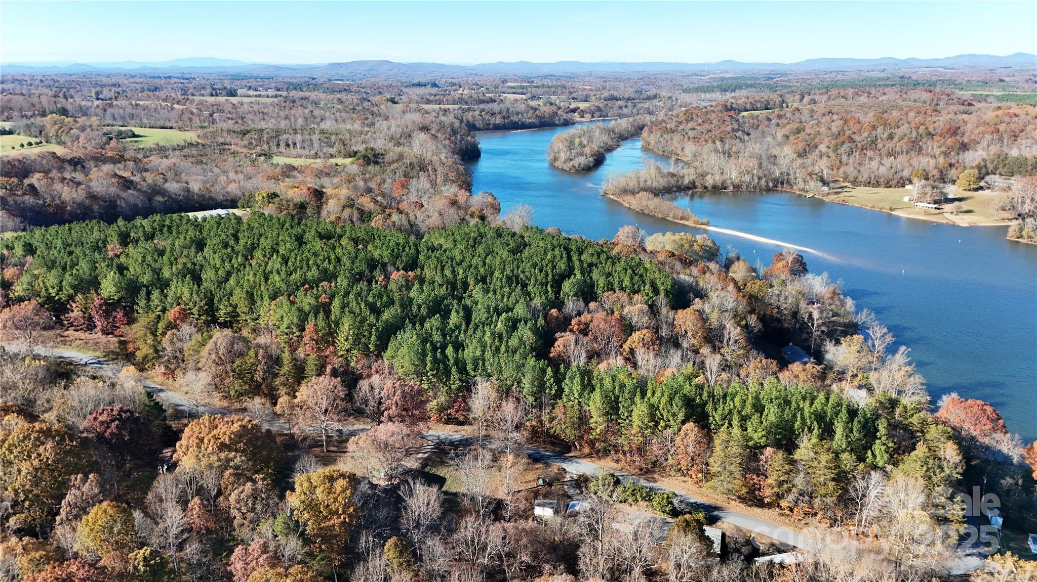 4270 Laurel Hill Road Claremont, NC 28610 - Photo 5 of 6 a view of a lake with mountains in the background