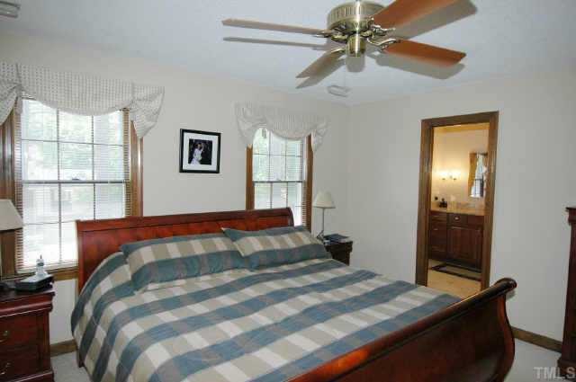 8109 Running Cedar Trail Raleigh, NC 27615 - Photo 7 of 11 a bedroom with a bed and a window