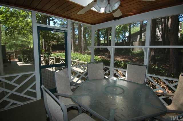 8109 Running Cedar Trail Raleigh, NC 27615 - Photo 9 of 11 a view of a dining room with furniture wooden floor and potted plants