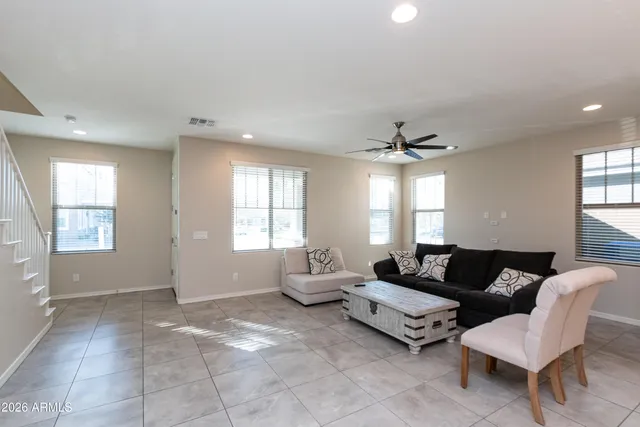 a living room with furniture and a large window
