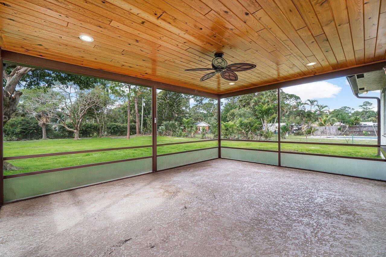 5567 2nd Road Lake Worth, FL 33467 - Photo 12 of 13 Screened patio