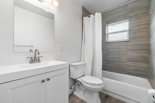 a bathroom with a sink a toilet and a bathtub