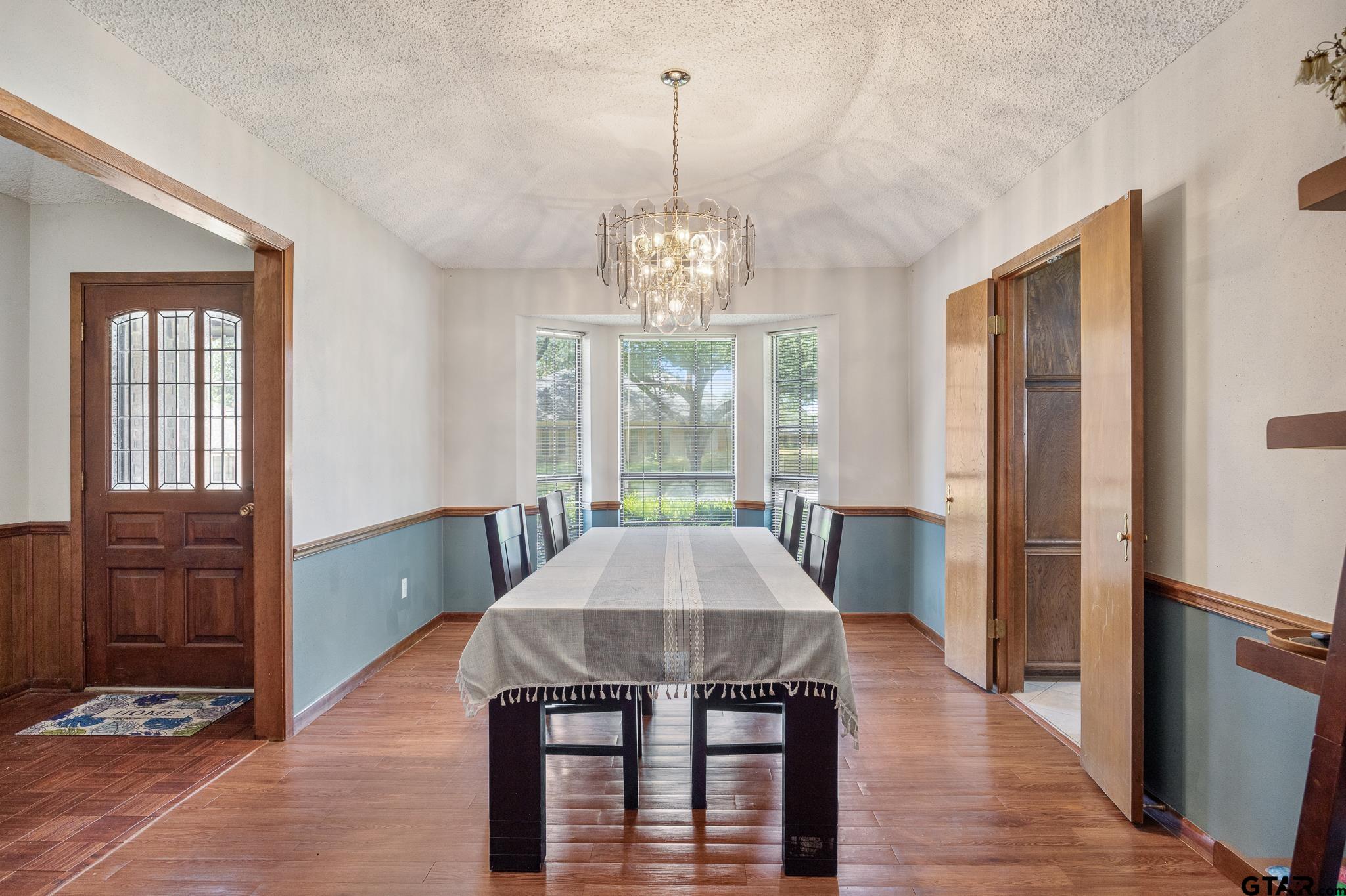 a view of a livingroom with furniture window and wooden floor