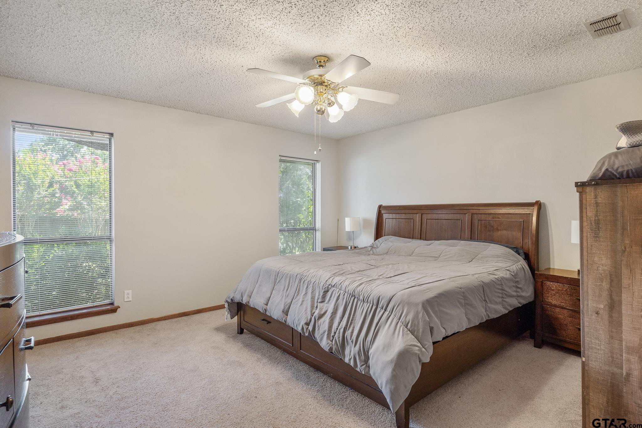802 Carriage Drive Tyler, TX 75703 - Photo 11 of 21 a bedroom with a bed and window
