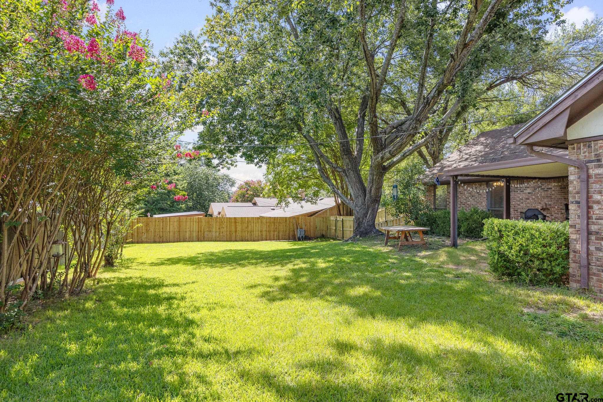 802 Carriage Drive Tyler, TX 75703 - Photo 15 of 21 a view of a house with a yard and a large tree